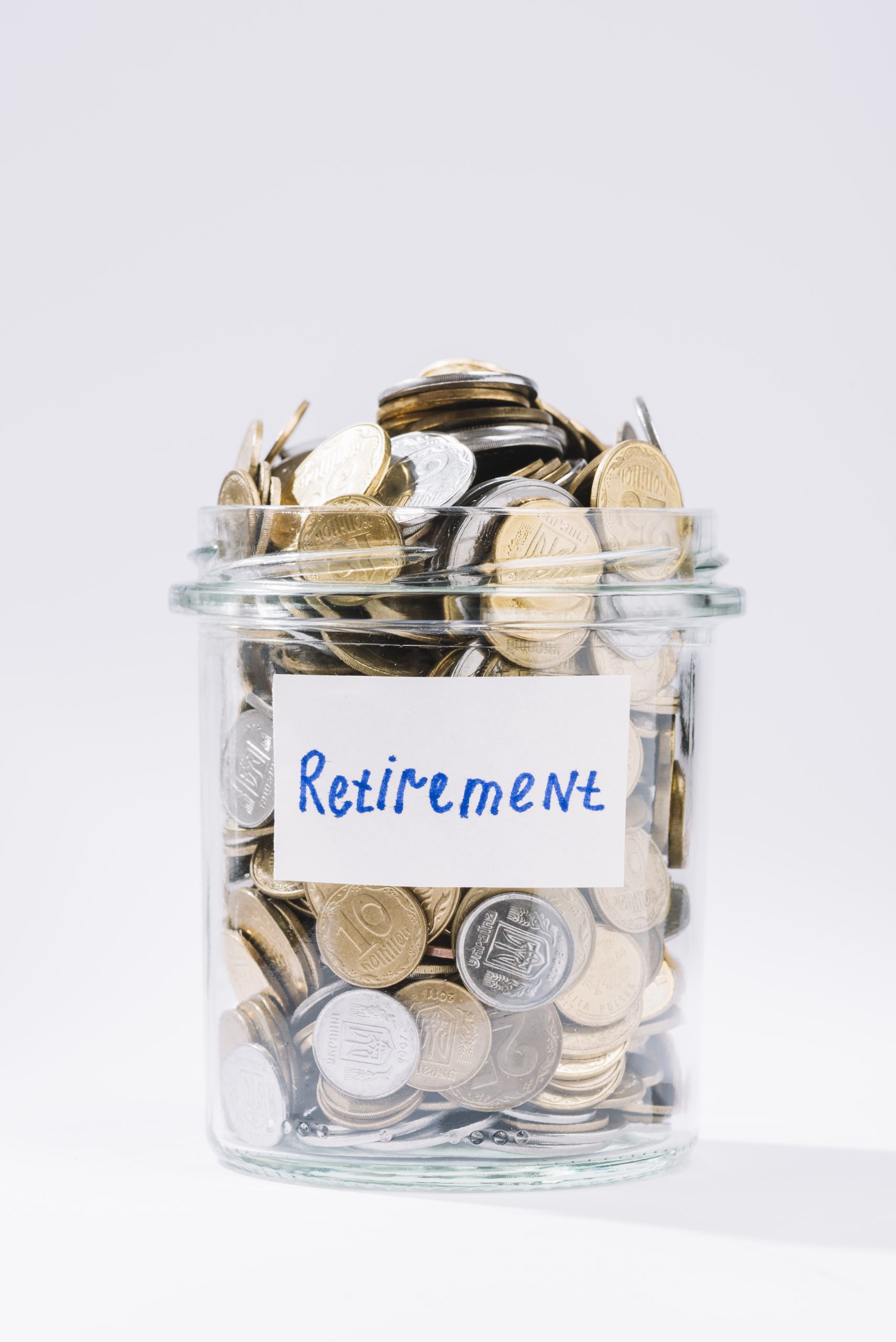 close-up-retirement-glass-container-full-coins-white-background
